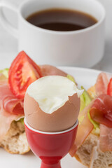closeup of a cooked egg with coffee
