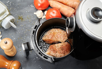Cooking skinless chicken breast with spices in an air fryer