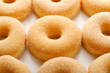 Sugar donuts on a white background, close up view