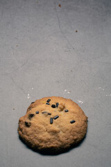 Circle tasty homemade chocolate cookie artisan made on a grey background