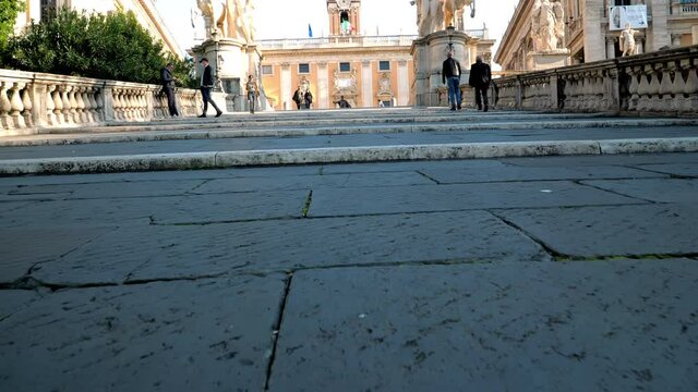 Going up the Cordonata Staircase that lead to the square Piazza del Campidoglio which is the political an religious heart of Rome, capital of Italy.