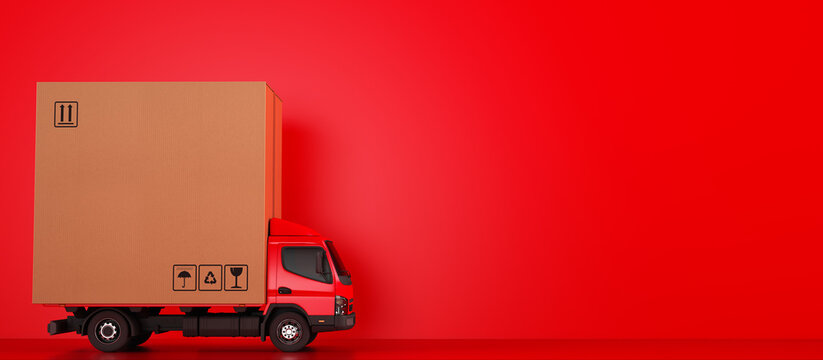 Big cardboard box package on a red truck ready to be delivered