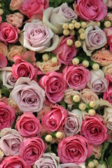 Pink and purple roses in a wedding centerpiece