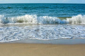Fototapeta premium Waves on sand beach