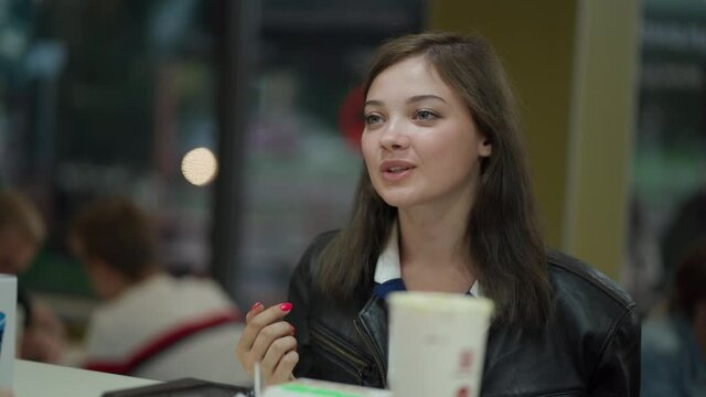 young woman having fun in a fast food cafe