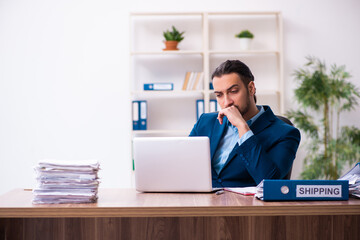 Fototapeta premium Young male businessman employee working in the office