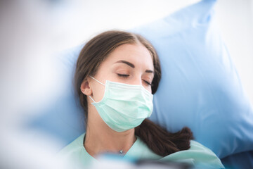 Doctors and patients person wearing surgical face masks in hospital room, health flu disease about coronavirus COVID-19