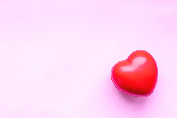 Fototapeta premium Valentines day red heart on pink paper background. Holidays card with copy space.