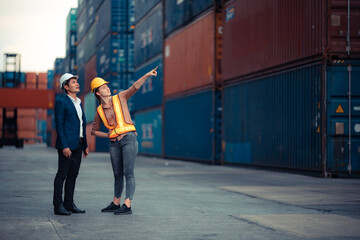 Businessmen, executives and engineers wear medical face masks. While inspecting industrial plants and warehouses for international shipping businesses Concepts of import and export