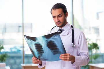 Young male doctor radiologist working in the clinic