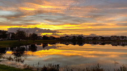 Beautiful pink, orange and blue sunset reflecting on a lake.