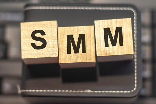 SMM - acronym from wooden blocks with letters, concept. SMM - Social Media Marketing