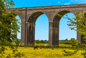A glimpse of the Harringworth railway viaduct from Seaton, UK