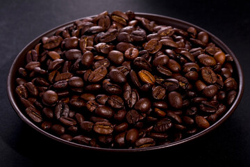 fresh roasted coffee beans on a dark background