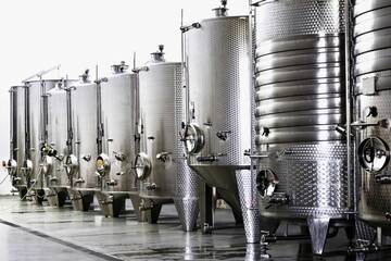 Modern wine factory with new large tanks for the fermentation. modern wine cellar with stainless steel tanks.