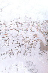 Frosty patterns on window glass in winter close up