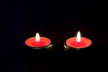 Burning light candles on black background. Holiday special and valentine concept. 