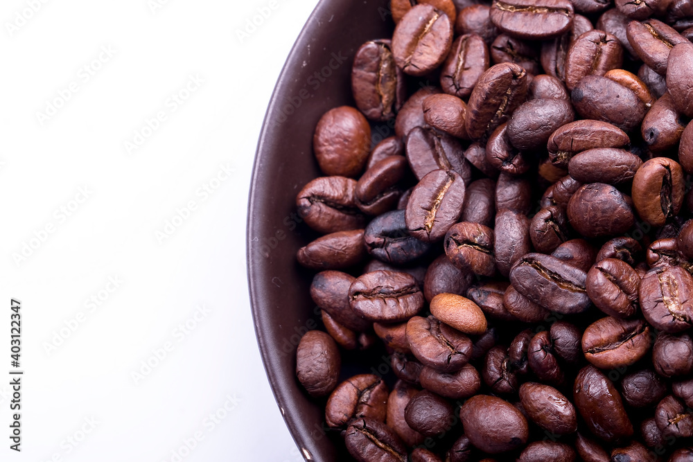 Wall mural fresh roasted coffee beans on a dark background