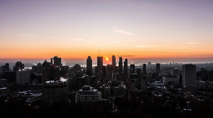 A sunrise view of downtown Montreal from Mount Royal.