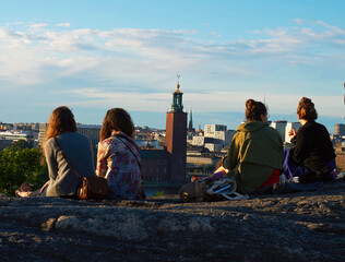 A group enjoying the view of a city. 