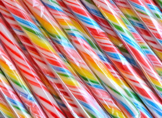 Lollipop background. Colorful lolly pops wrapped in cellophane.