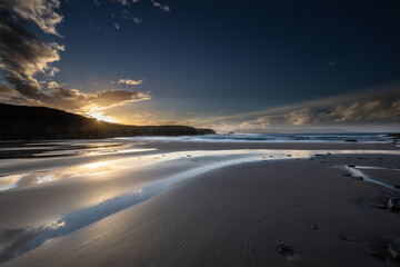 Winter sunset with reflections of clouds on the beach of Las Islas!