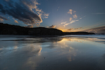 Winter sunset with reflections of clouds on the beach of Las Islas!