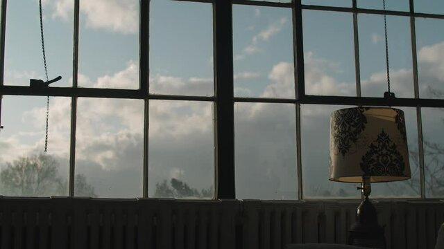 Sky view from a loft apartment with lamp in foreground