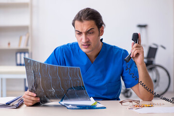 Young male doctor radiologist working in the clinic