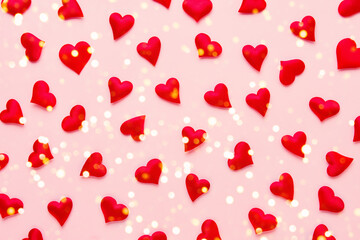 Valentines Day concept. Red hearts on pink background. Flat lay