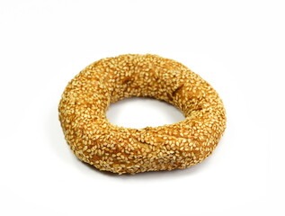 Fullgrain bagel with seeds isolated on white background. Fresh breakfast bread bagel roll with seeds isolated on white background.