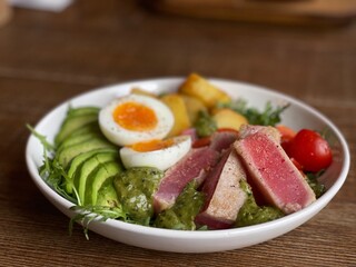 salad with raw tuna, egg and avocado