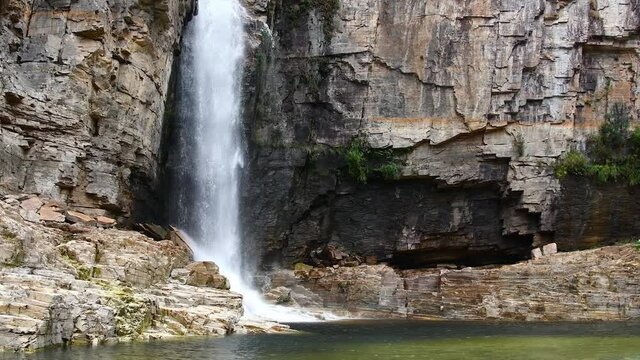 Waterfall of the Canyons de Furnas at Capit&oacute;lio - MG, Brazil. Canyons composed of sedimentary rocks, green vegetation and the green water of the lake of Furnas, also known as Mar de Minas.