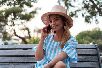 Fototapeta premium A woman talking on her cell phone