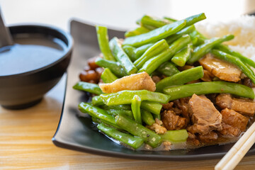 angle view fast food duck meat with pork and peanuts and beans with rice and porridge horizontal composition