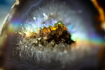 Beautiful inside of Agate crystal magic gem stone. Iridescent natural geometric cluster.