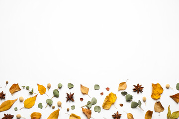 Flat lay composition with autumn leaves and space for text on white background