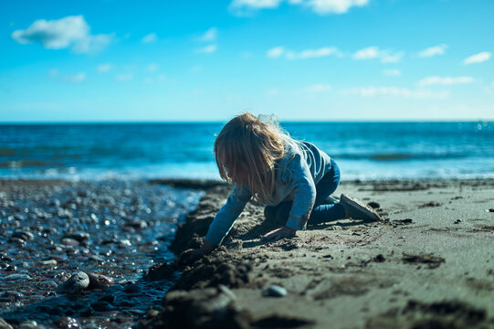 Preschooler playing on the beach