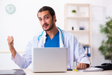 Young male doctor working in the clinic