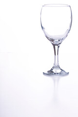 An empty wine glass on a white background