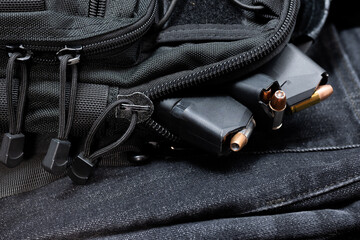 a tactical bag full of loaded magazines for a hand gun