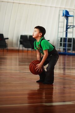child playing basketball