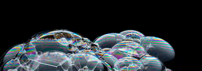 The rainbow bubbles isolated on black background