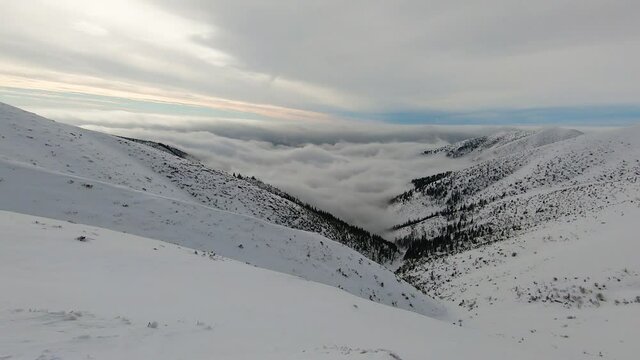 Timelapse Of A Winter Valley During Inverse Clouds