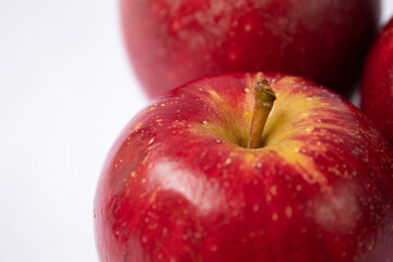 Close up of ripe red apple on white background