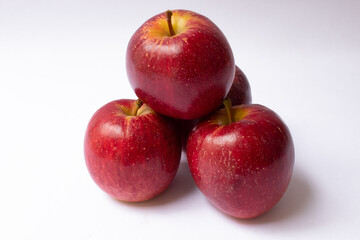 Fototapeta na wymiar Pile of red apples isolated on white background