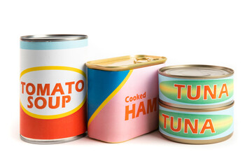 a collection of generic labeled food tins or cans, ham. tomato soup, tuna, isolated on white