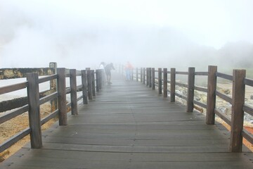 The newest tourist spot of the Kahyangan Bridge from the Sikidang Crater tourist attraction. Dieng Indonesia
