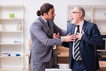 Two employees in pandemic concept at workplace