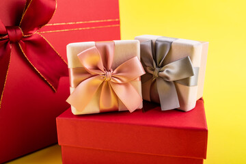 A pile of gift boxes on yellow background